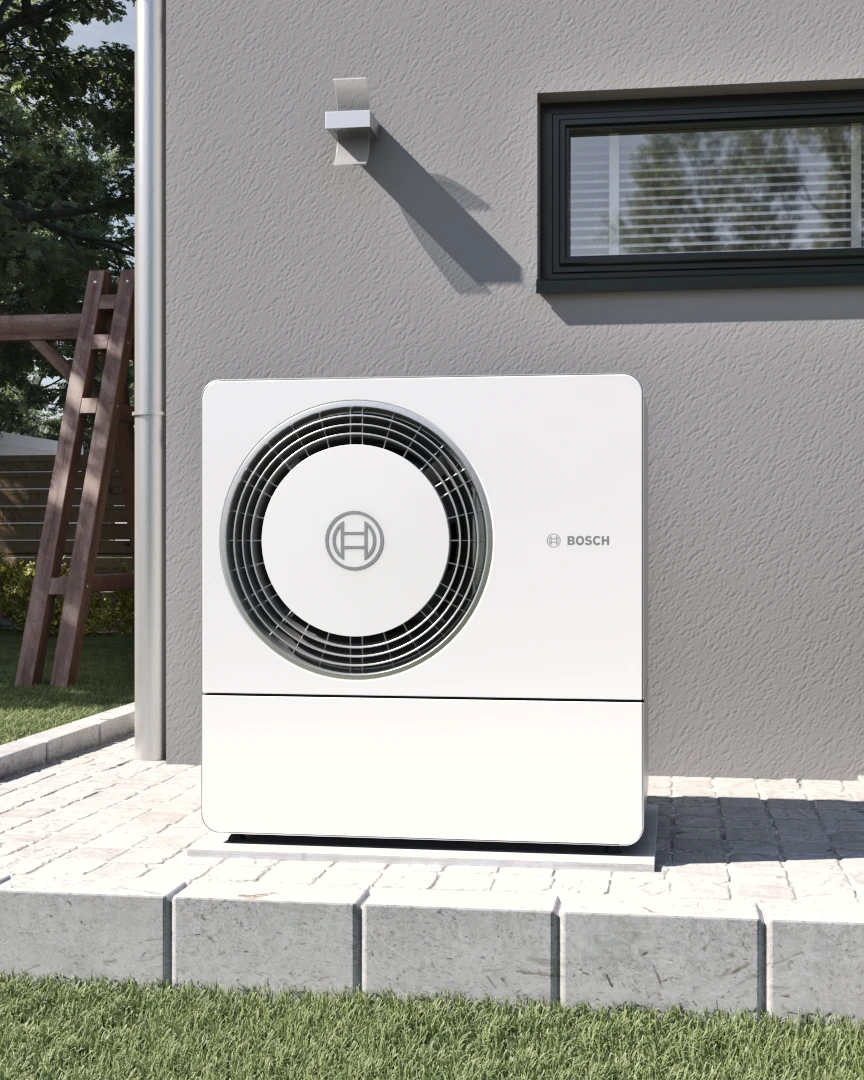 Bosch Compress Außeneinheit auf einer Terrasse vor einem Wohnhaus – Hersteller-Anwendungsmotiv